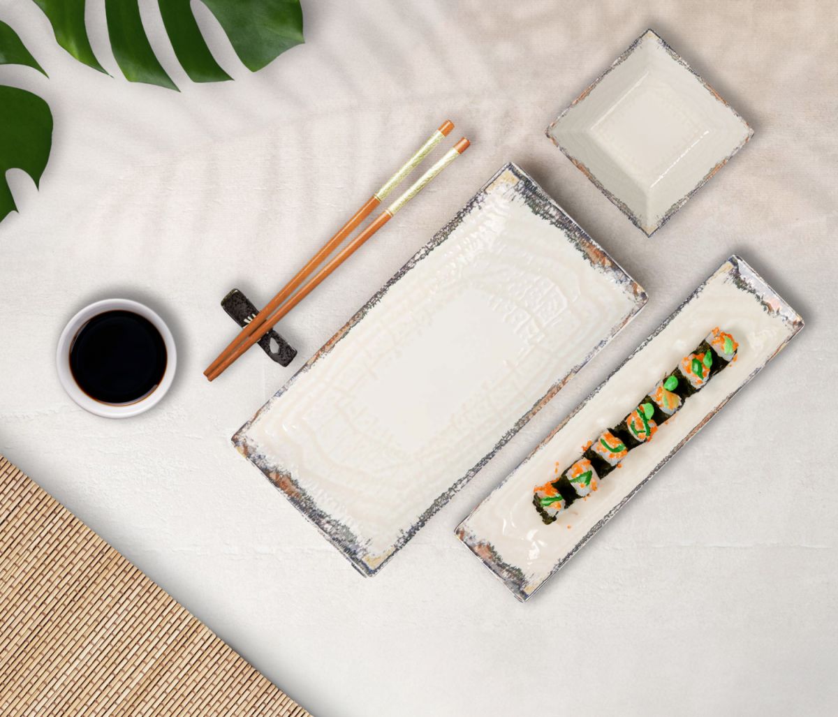White rectangular ceramic plates with textured dark gray edges for serving sushi