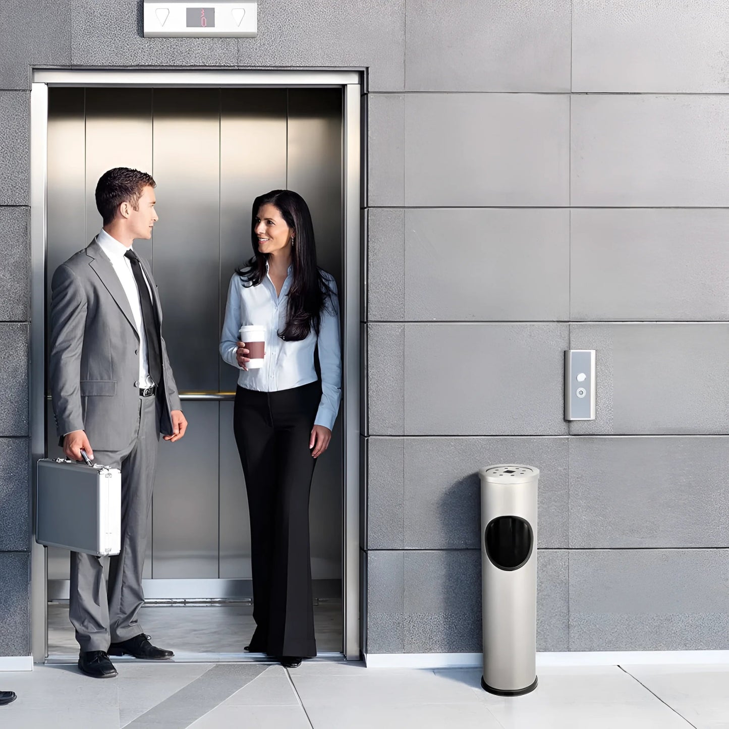 Business professionals standing in an elevator near a stainless steel outdoor dust rubbish bin