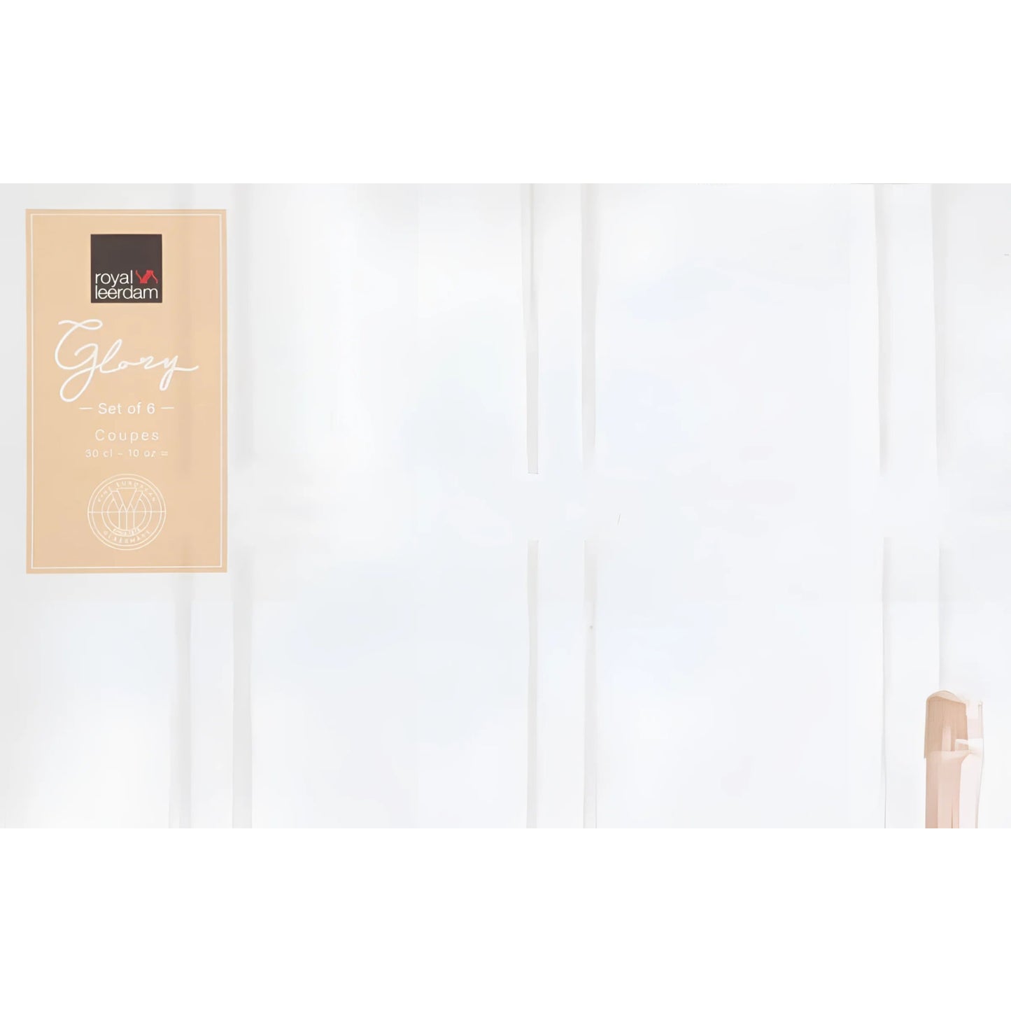 Packaged light-brown chocolate bar in front of Vintage Champagne Saucer Glasses 300ml