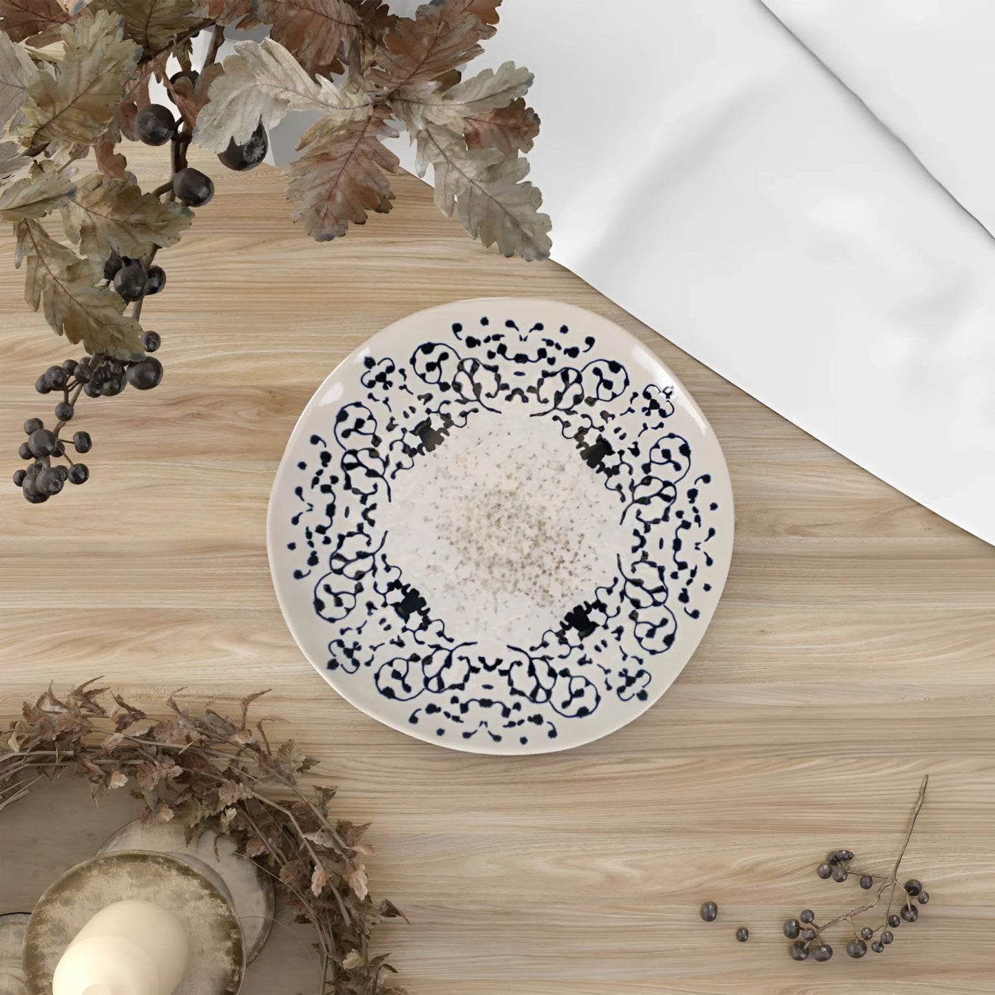 White ceramic Jerica Iberica bowl with black and gray decorative pattern, irregular shape