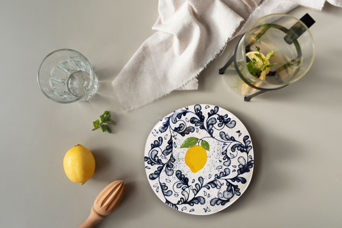White ceramic Limoi Iberica pasta bowl with yellow lemon center and blue floral patterns