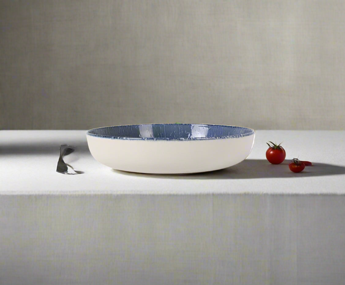 Wide white ceramic Nordic Olaf 23cm stoneware pasta bowl with textured blue interior
