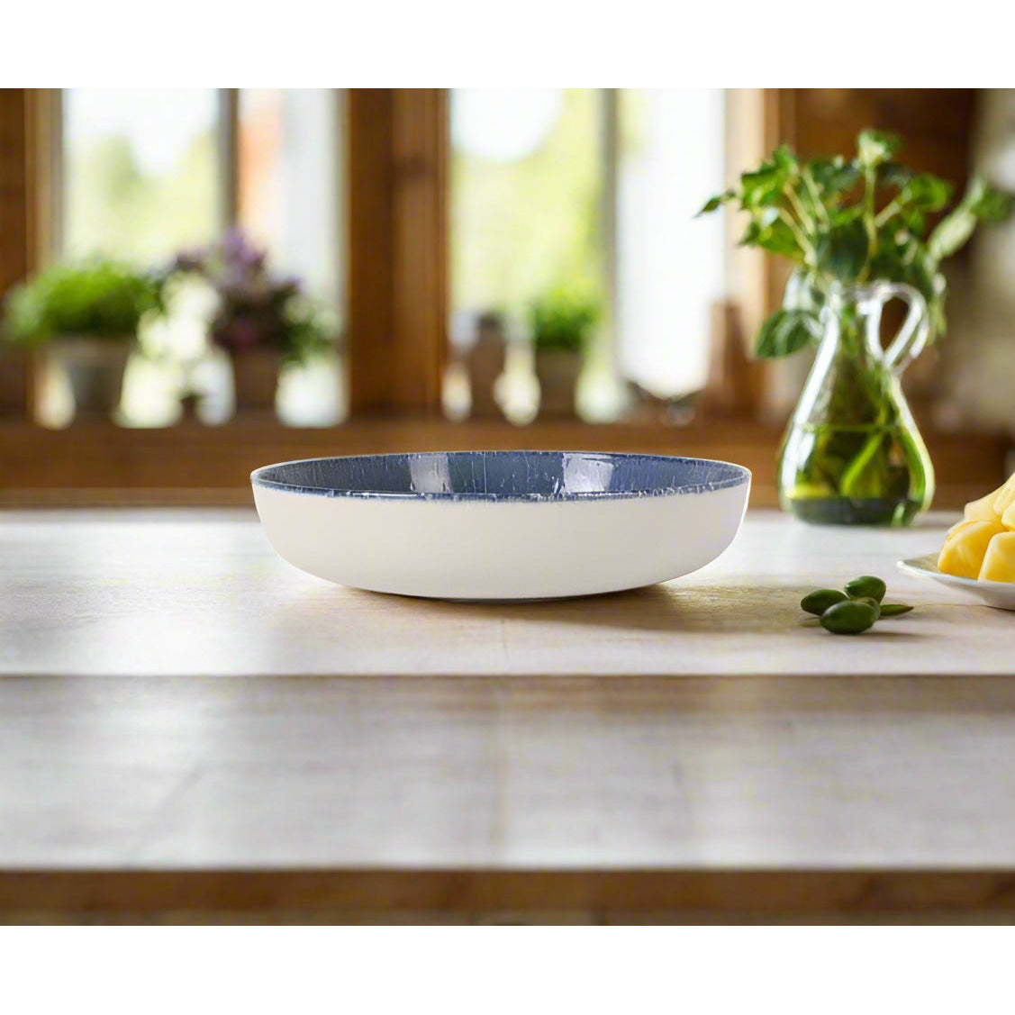 Nordic Olaf 23cm stoneware pasta bowl with white exterior and textured blue interior