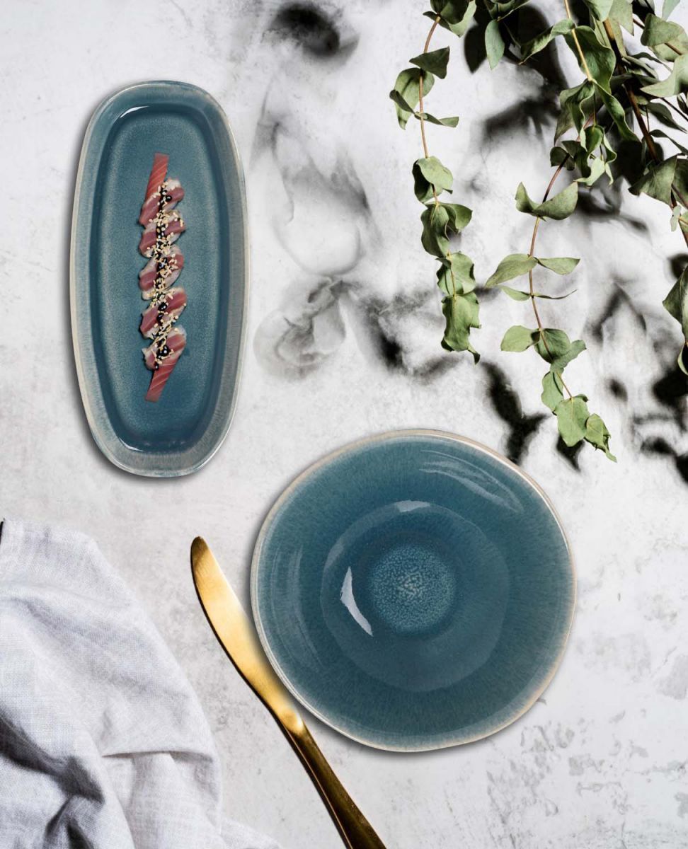 Ocean Blue ceramic dinnerware set with oval platter and round bowl in irregular shape