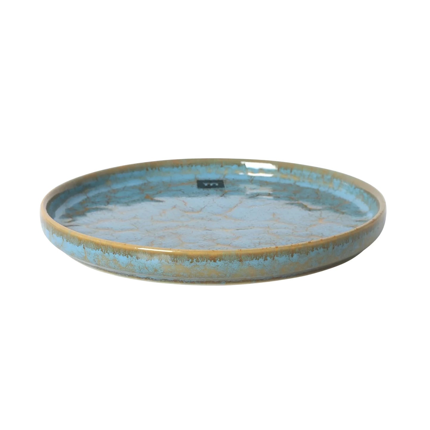 Round blue ceramic dessert plate with a shallow shape and golden-brown rim