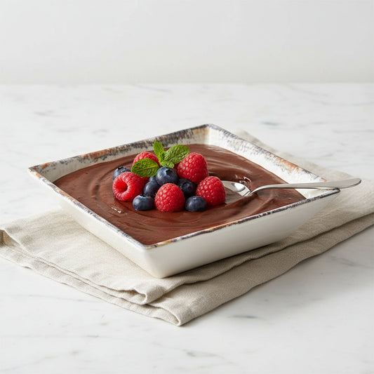 A square white ceramic bowl with a textured interior and a rustic metallic gold-rimmed edge, shown alongside a smaller inset view of the same bowl on a plain white background.