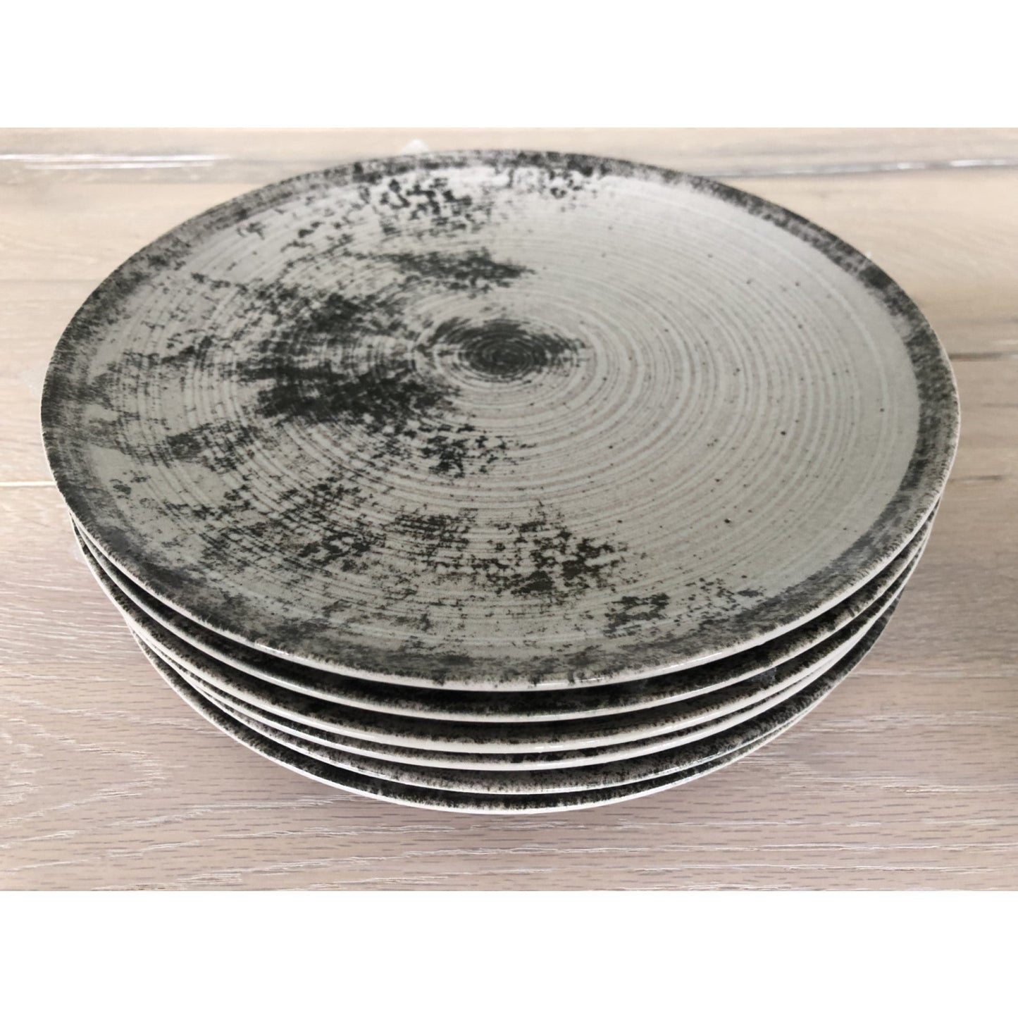 Stack of decorative ceramic plates for Aspe Montecarlo Grey Matt 26cm Dinner Plate