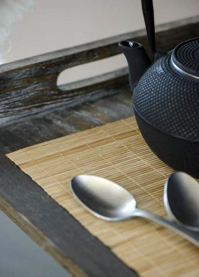 Black cast iron textured teapot on Bamboo Placemats 30x45cm Black