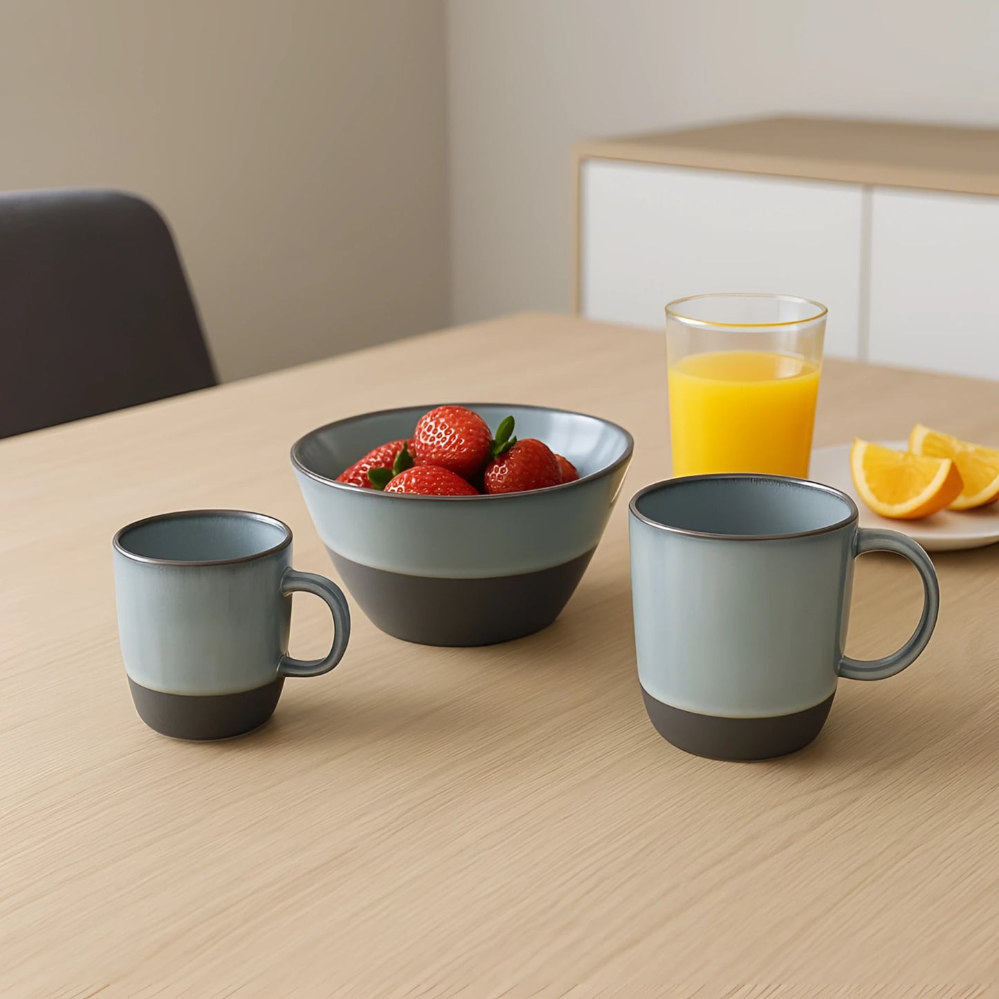 Three two-tone ceramic mugs, light gray top, dark charcoal base