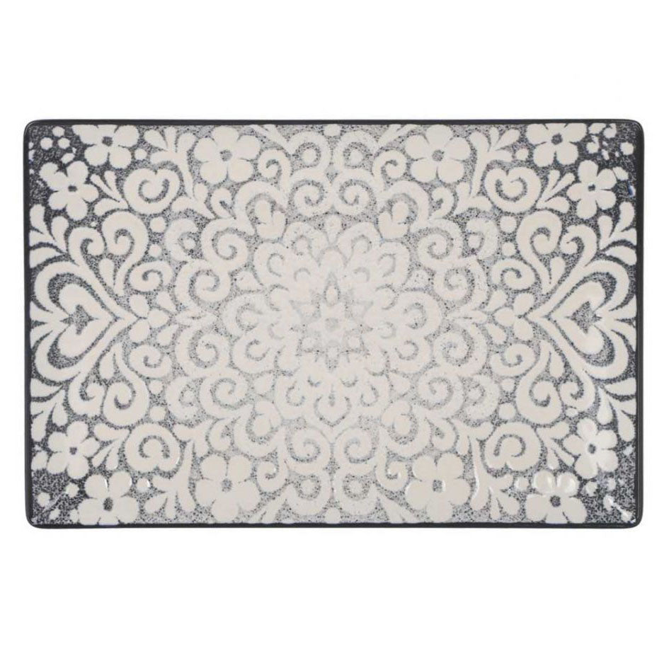 A rectangular area rug with a distressed, vintage-style damask pattern in cream and charcoal gray, shown flat against a white background.