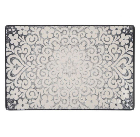 A rectangular area rug with a distressed, vintage-style damask pattern in cream and charcoal gray, shown flat against a white background.