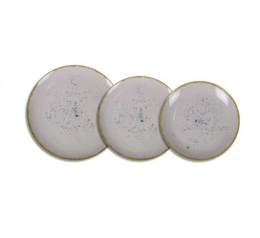 Three round ceramic plates with a speckled off-white glaze, blue speckles, and a thin gold rim, arranged in a row on a white background.