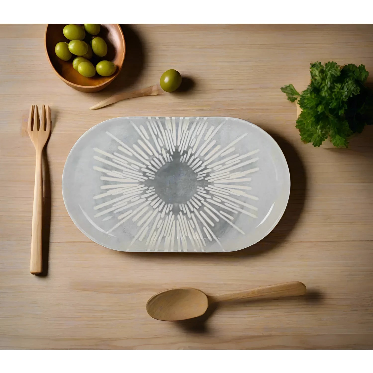 Oval serving platter with sunburst relief design in Grey Irys Stoneware for desserts and tapas