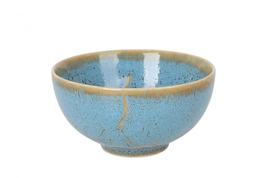 Light blue ceramic Japo Bowl with tan rim and visible gold-colored repair