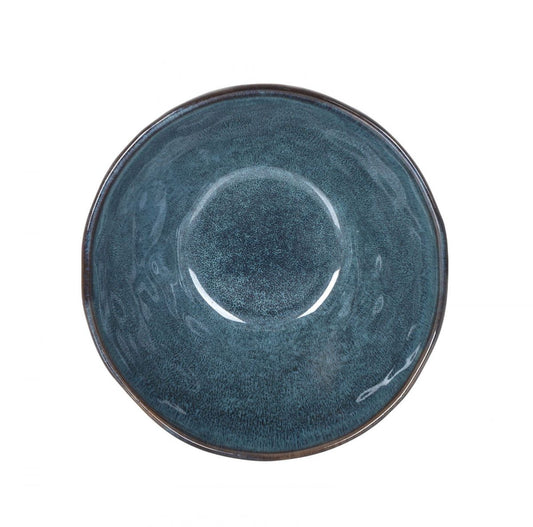 Dark teal ceramic bowl with textured reactive glaze and dark rim for serving or decor