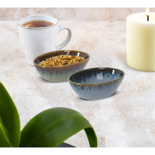 Two Pica Pica ramekins with gradient green blue glaze, one with granola