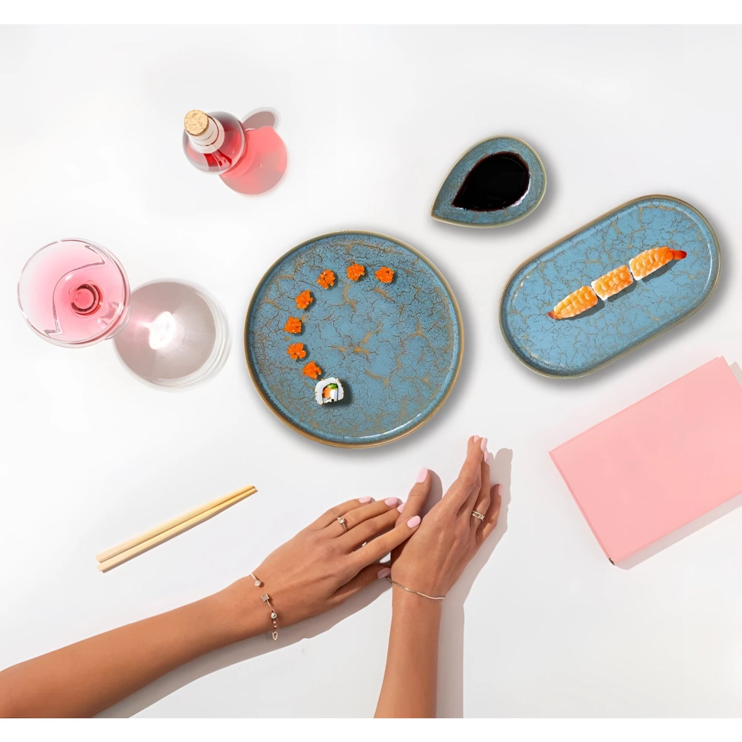 Scratch Blue 15.6x6.8cm bowl with crackled blue glaze, gold accents, orange flower garnishes, rainbow sushi