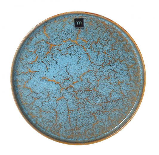 Blue glazed ceramic dinner plate with crackled distressed finish and earthy brown accents
