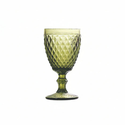 Green textured glass goblet on a white background