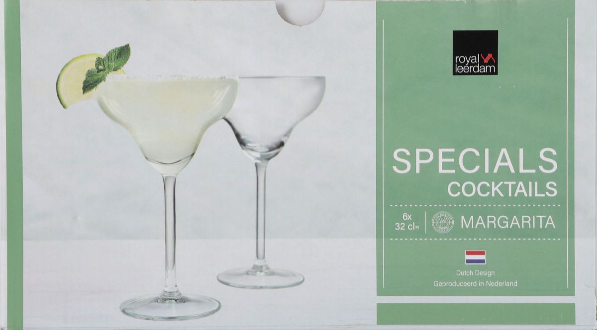Clear glass margarita cocktail glasses with filled drink, lime, and mint garnish