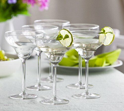 Clear Royal Leerdam margarita glasses with light-colored cocktails and lime garnishes