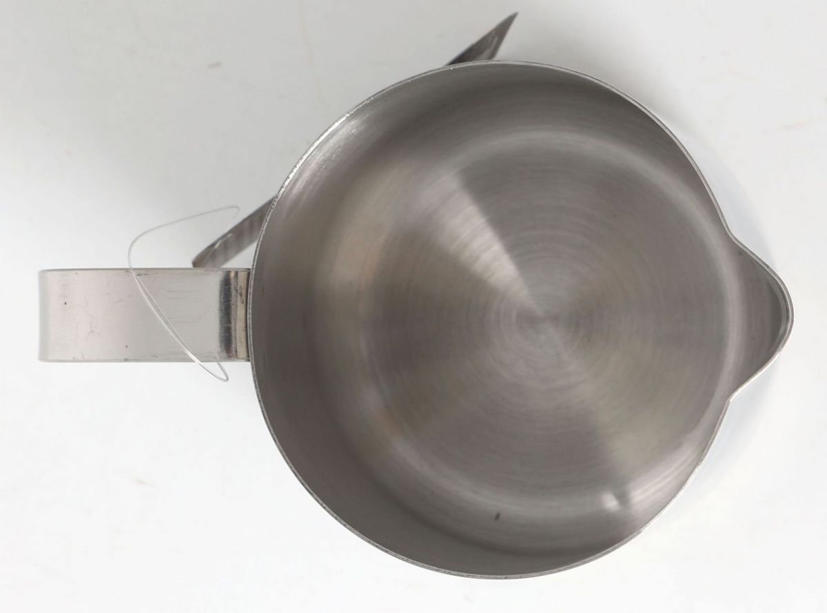 Stainless steel milk frothing jug with handle and pouring spout for coffee and latte making